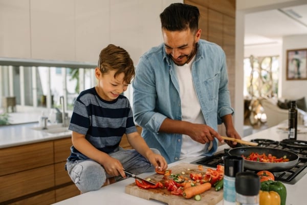 image of a father and son preparing food
